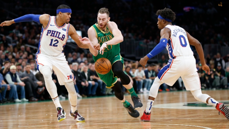 Boston Celtics forward Gordon Hayward (20) and Philadelphia 76ers forward Tobias Harris (12) and guard Josh Richardson (0)