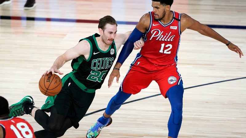 Boston Celtics forward Gordon Hayward (20) and Philadelphia 76ers forward Tobias Harris (12)