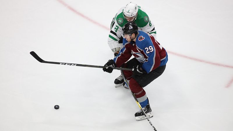 Colorado Avalanche center Nathan MacKinnon and Dallas Stars defenseman Jamie Oleksiak