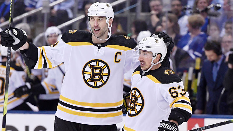 Boston Bruins defenseman Zdeno Chara and left wing Brad Marchand