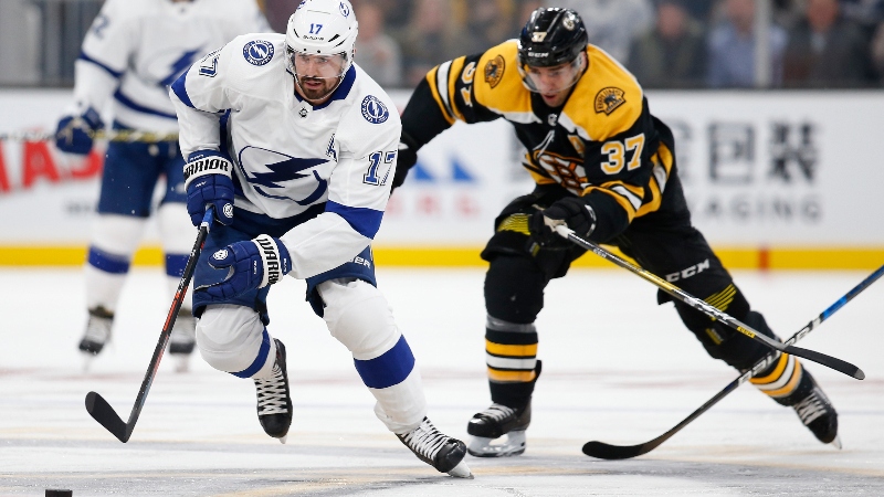 Tampa Bay Lightning left wing Alex Killorn (17) and Boston Bruins center Patrice Bergeron (37)