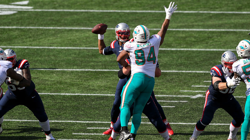 New England Patriots quarterback Cam Newton and Miami Dolphins defensive tackle Christian Wilkins