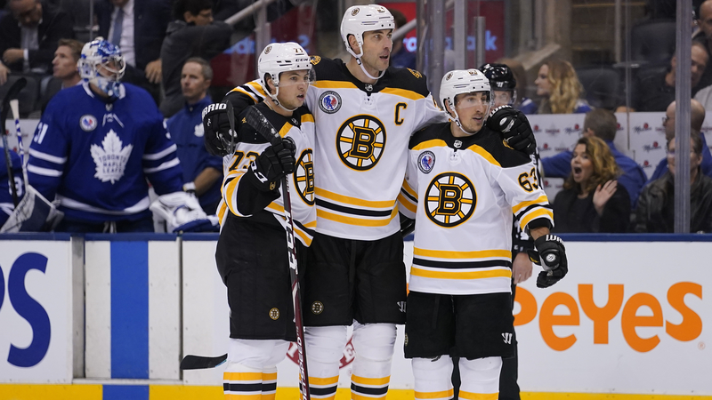 Boston Bruins' Charlie McAvoy, Zdeno Chara And Brad Marchand