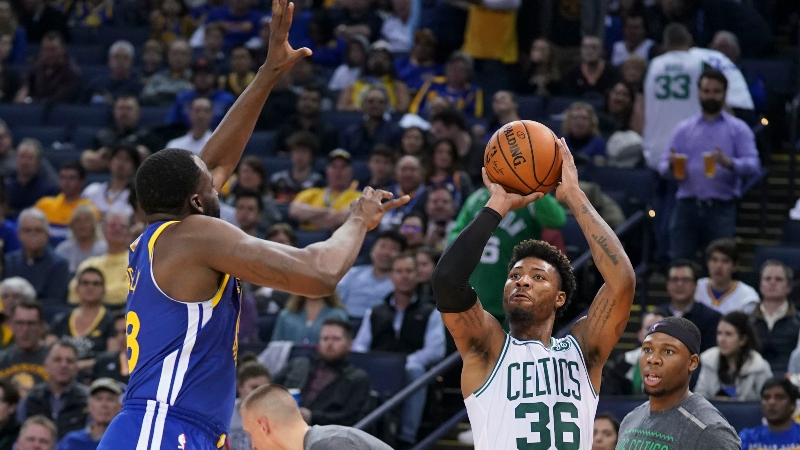 Boston Celtics guard Marcus Smart (36) and Golden State Warriors forward Draymond Green (23)