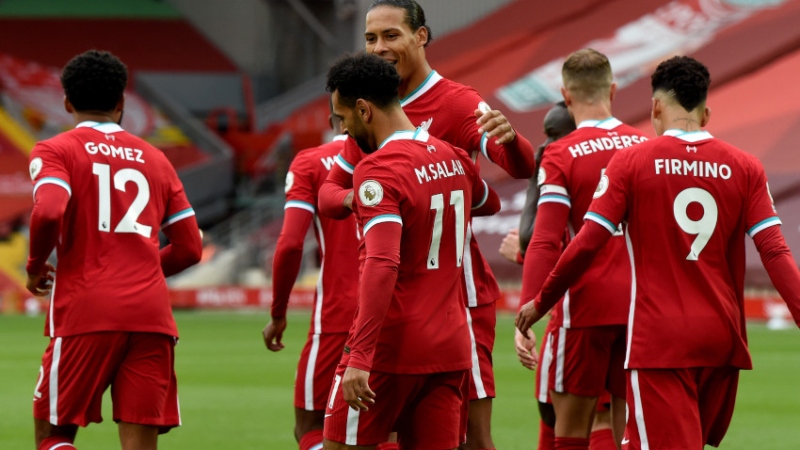 Liverpool forward Mohamed Salah (11), defender Virgil van Dijk (4) and teammates