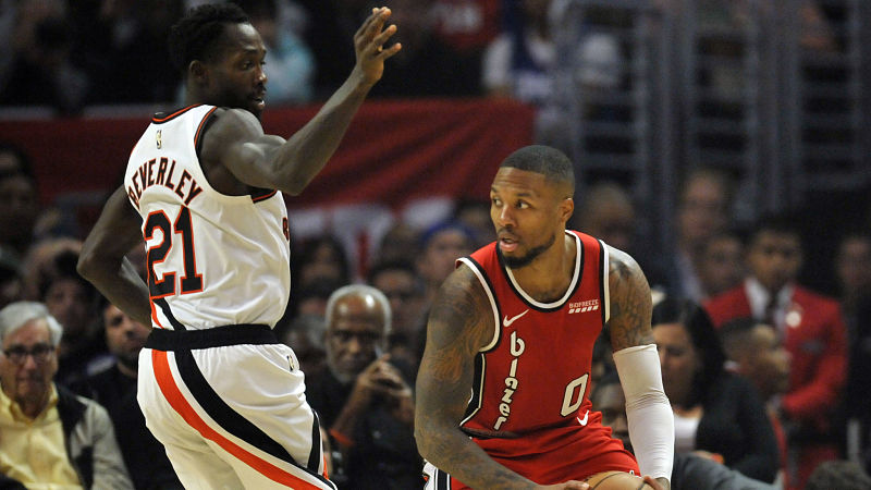 Los Angeles Clippers guard Patrick Beverley and Portland Trail Blazers guard Damian Lillard