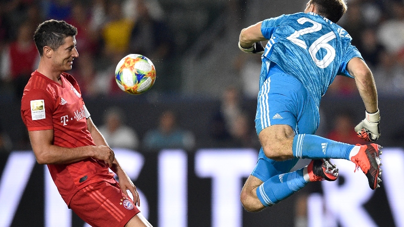Bayern Munich forward Robert Lewandowski (left) and former Arsenal goalkeeper Emiliano Martinez (26)