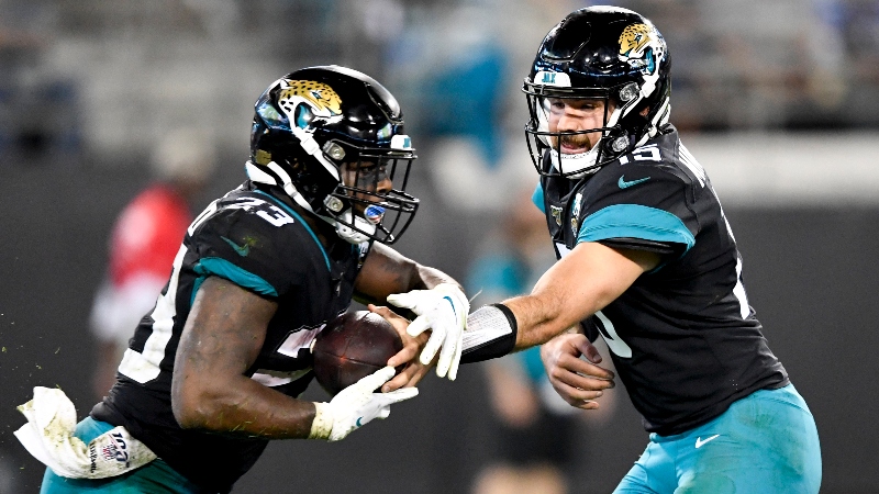 Jacksonville Jaguars quarterback Gardner Minshew II (15) and running back Ryquell Armstead (23)