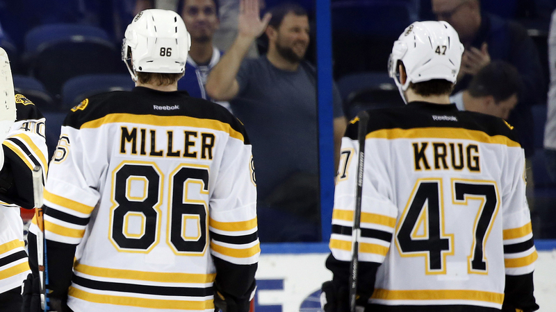 Boston Bruins Defenseman Kevan Miller And St. Louis Blues Defenseman Torey Krug