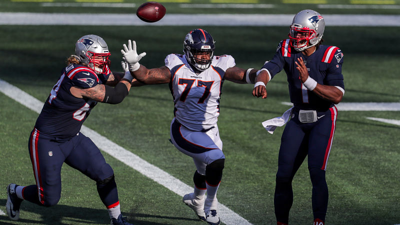 Denver Broncos defensive end Timmy Jernigan and New England Patriots quarterback Cam Newton