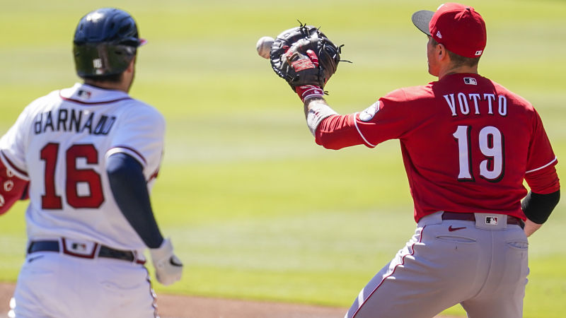 Atlanta Braves catcher Travis d'Arnaud and Cincinnati Reds first baseman Joey Votto