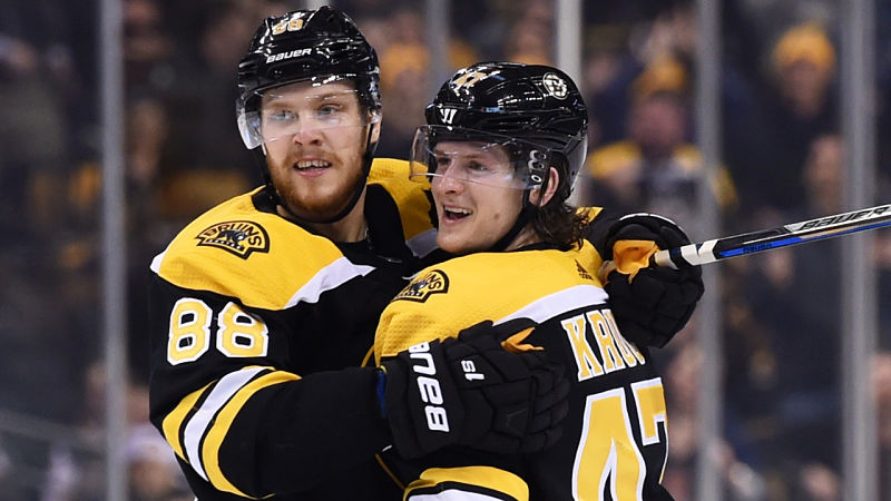 Boston Bruins forward David Pastrnak and St. Louis Blues defenseman Torey Krug