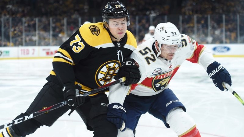 Boston Bruins defenseman Charlie McAvoy, Florida Panthers defenseman MacKenzie Weegar
