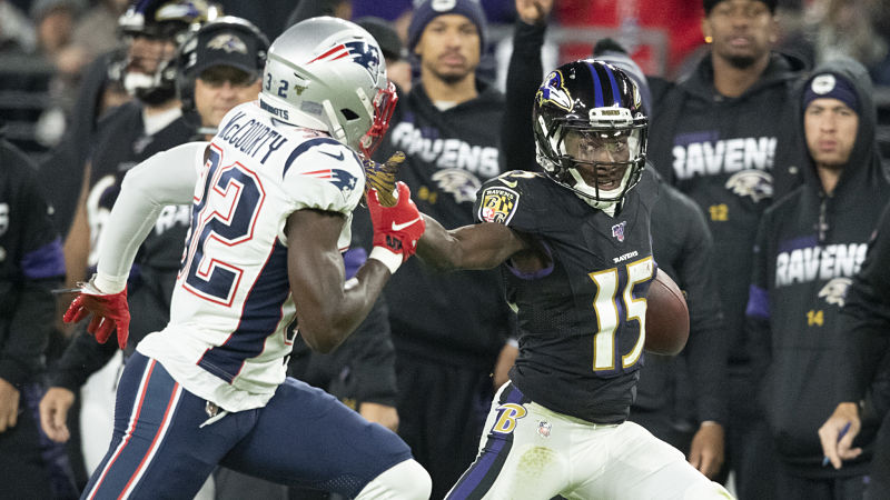 New England Patriots safety Devin McCourty and Baltimore Ravens wide receiver Marquise Brown