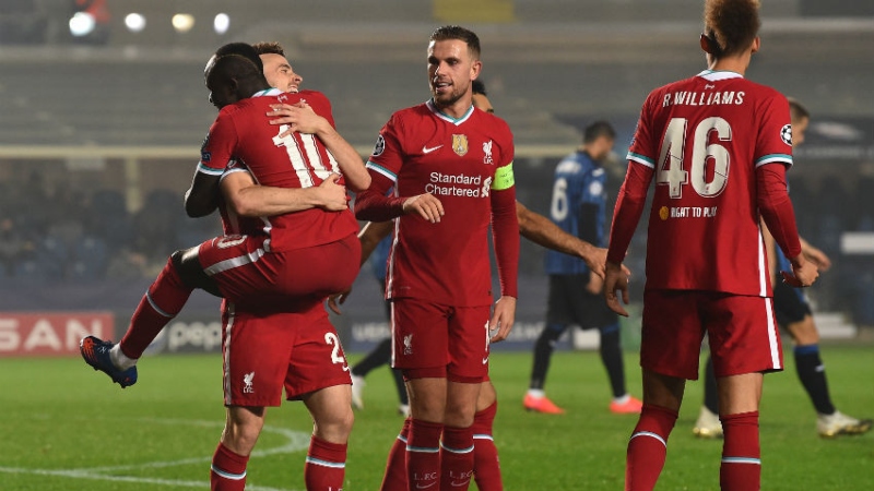 Liverpool forwards Diogo Jota (left) and Sadio Mane (10) and teammates