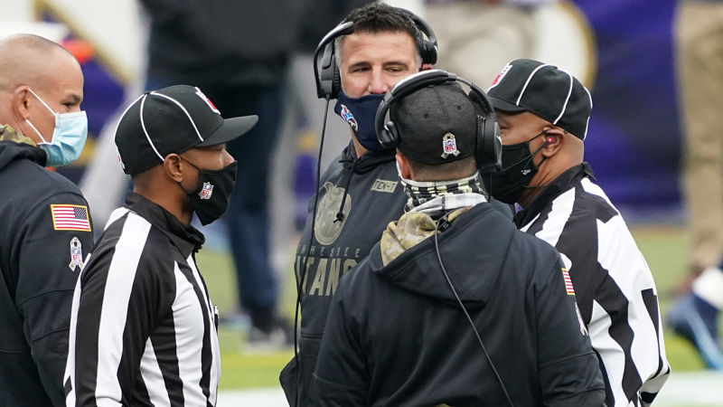 Tennessee Titans head coach Mike Vrabel and Baltimore Ravens head coach John Harbaugh
