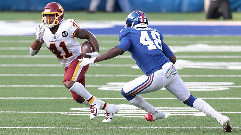 Washington Football Team running back J.D. McKissic and New York Giants linebacker Tae Crowder