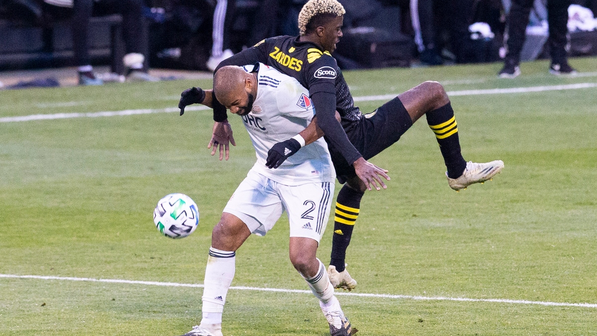 Columbus Crew SC forward Gyasi Zardes (right) and New England Revolution defender Andrew Farrell (2)