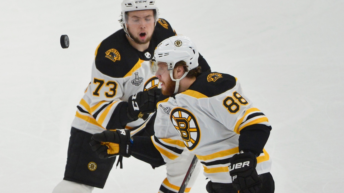 Boston Bruins right wing David Pastrnak (88) and defenseman Charlie McAvoy (73)