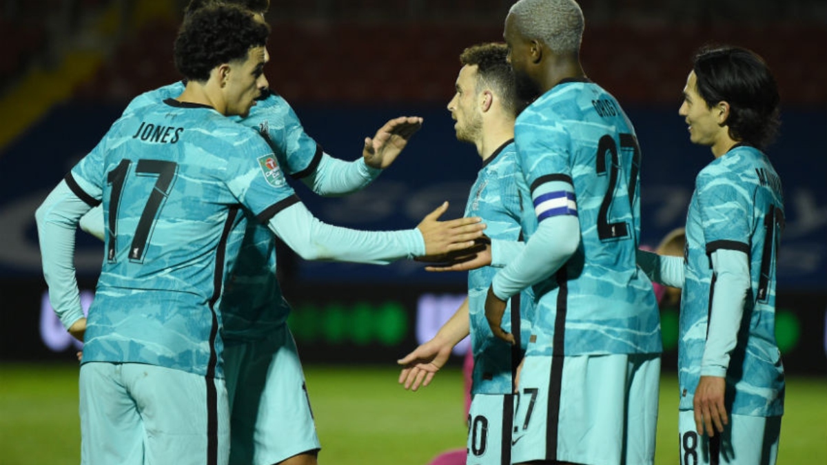 Liverpool midfielder Curtis Jones (17), and forwards Diogo Joto (20), Divock Origi (27) and Takumi Minamino (18)