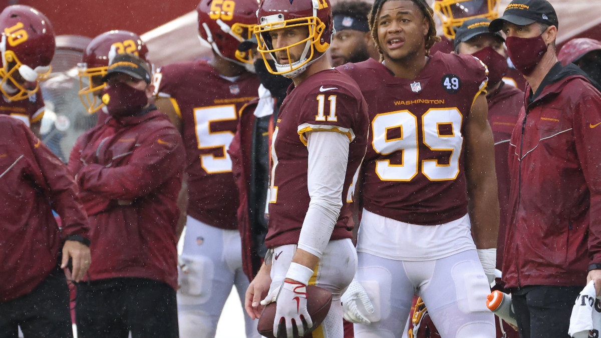 Washington Football Team quarterback Alex Smith (11) and Washington Football Team defensive end Chase Young (99)