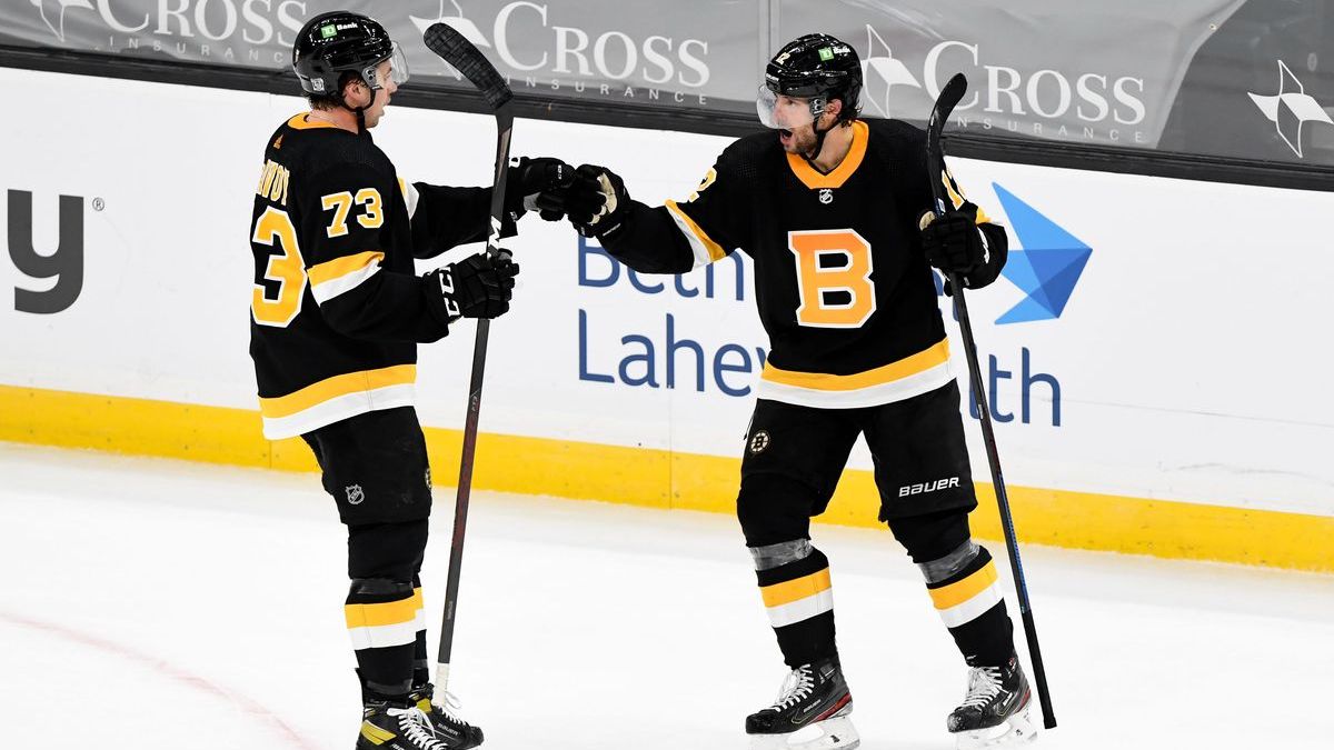 Boston Bruins defenseman Charlie McAvoy, right winger Craig Smith