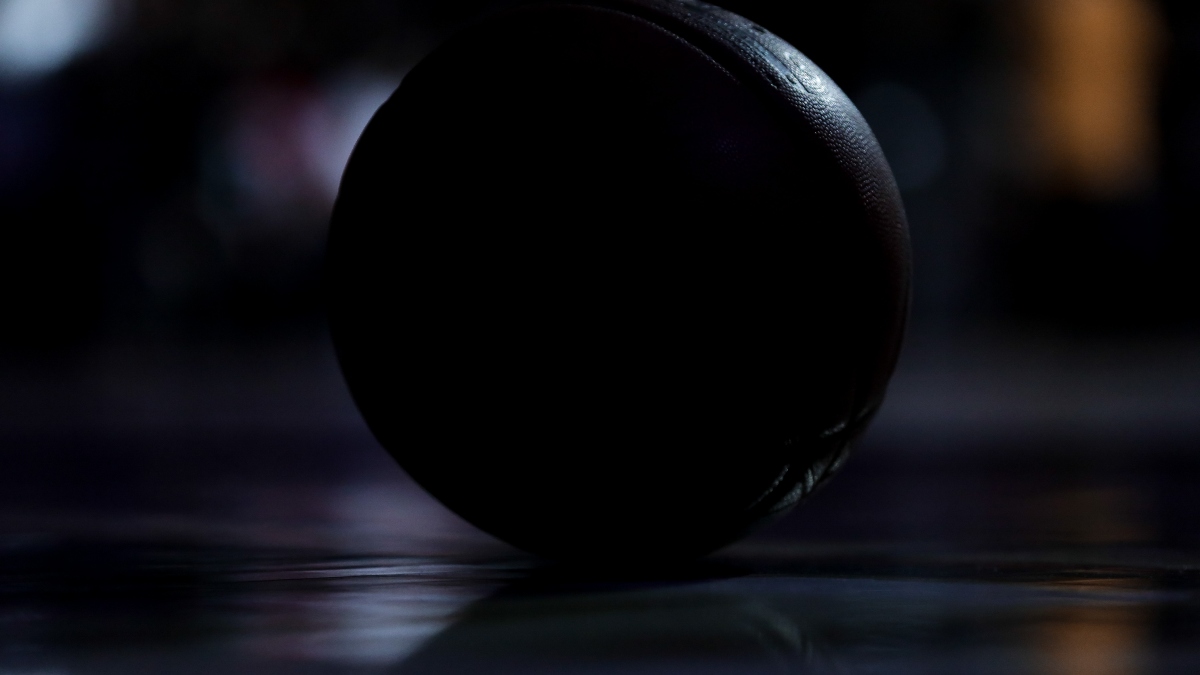 A detail of a NBA Basketball in shadows