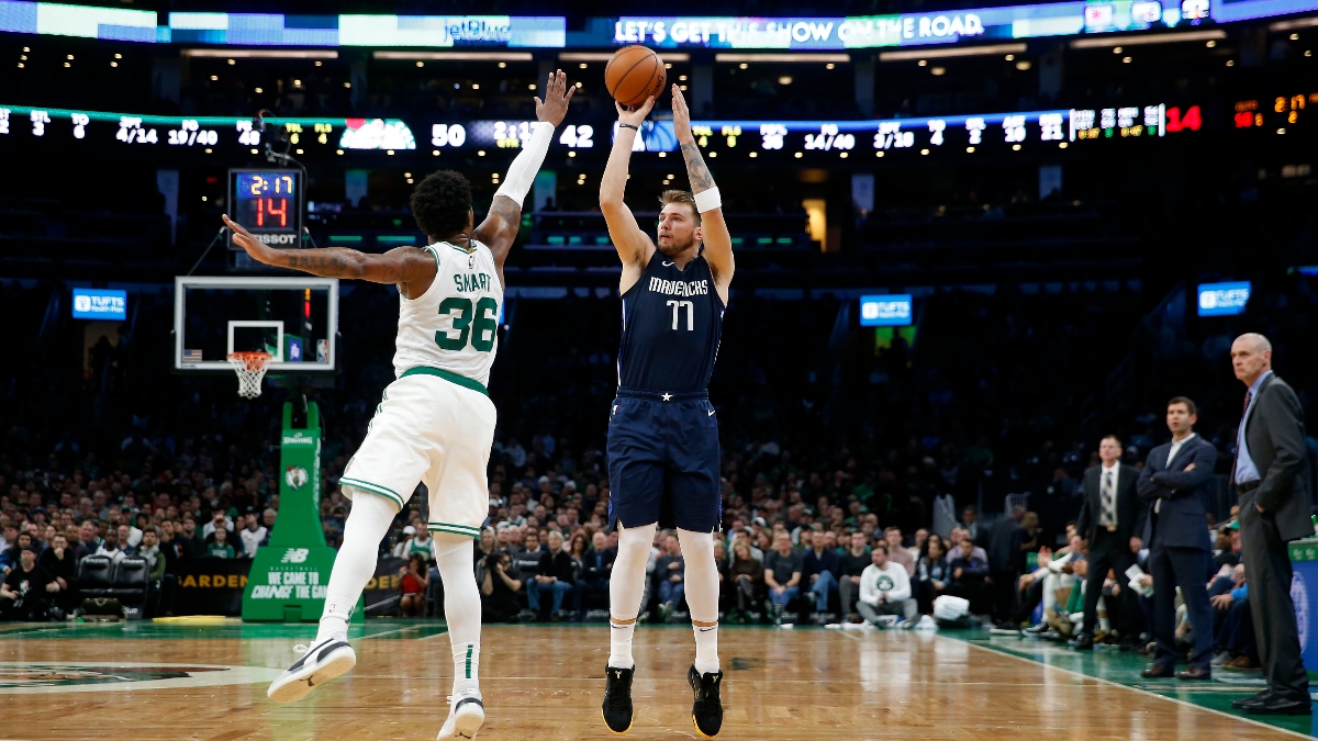 Dallas Mavericks guard Luka Doncic (77) and Boston Celtics guard Marcus Smart (36)