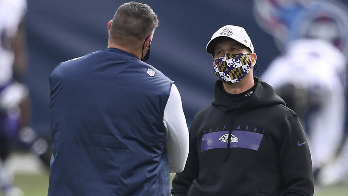 Tennessee Titans head coach Mike Vrabel and Baltimore Ravens head coach John Harbaugh