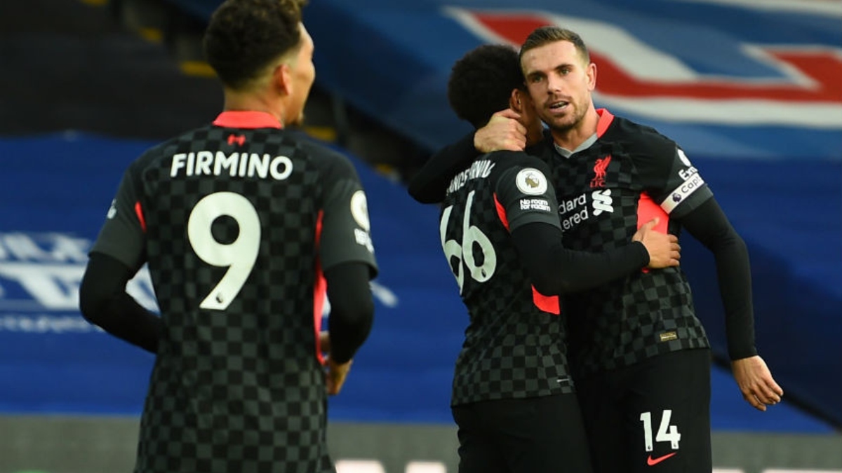 Liverpool midfielder Jordan Henderson (right), defender Trent Alexander-Arnold (center) and forward Roberto Firmino
