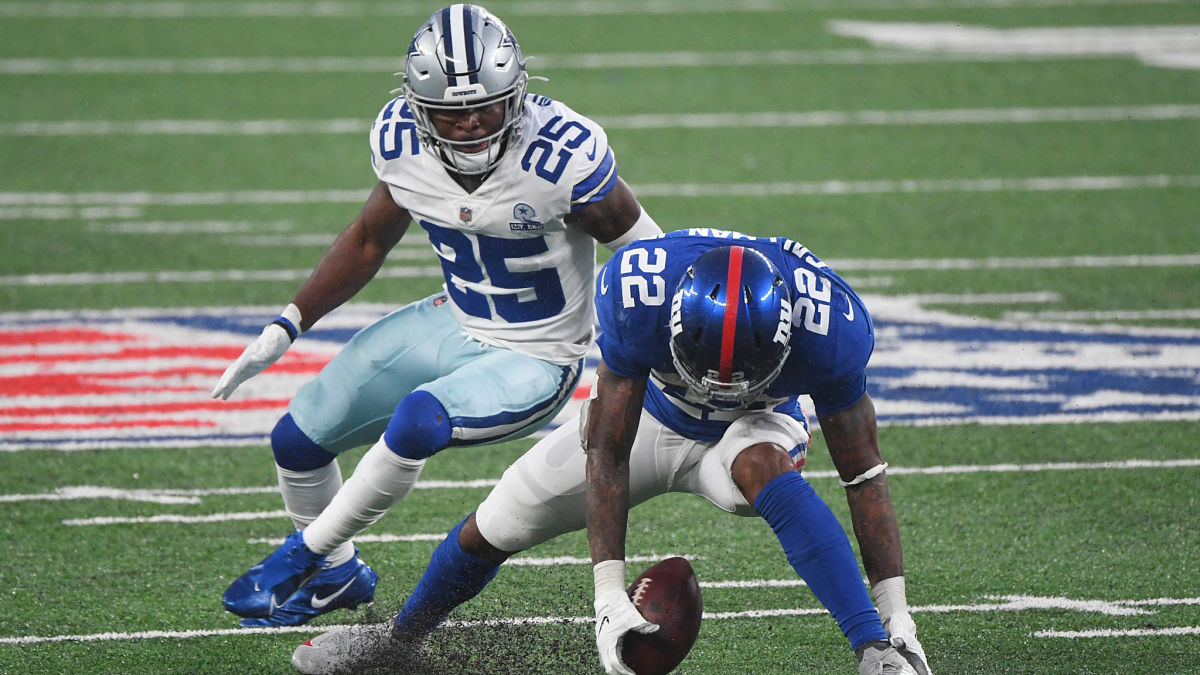 Dallas Cowboys cornerback Xavier Woods and New York Giants running back Wayne Gallman