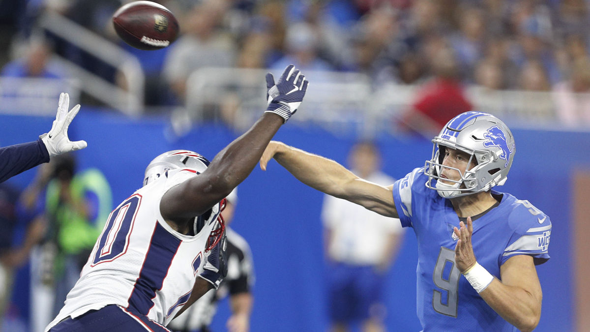 New England Patriots defensive tackle Adam Butler and Los Angeles Rams quarterback Matthew Stafford