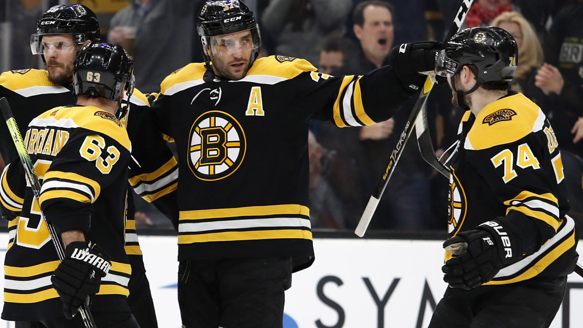 Boston Bruins forwards Brad Marchand, Patrice Bergeron, Jake DeBrusk