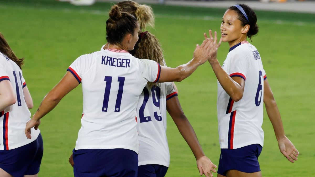 United States forward Lynn Williams (6) and defender Ali Krieger (11)