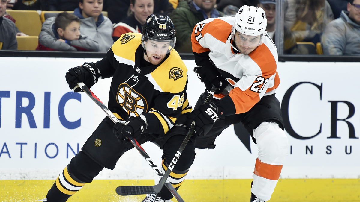 Boston Bruins defenseman Matt Grzelcyk, Philadelphia FLyers forward Scott Laughton