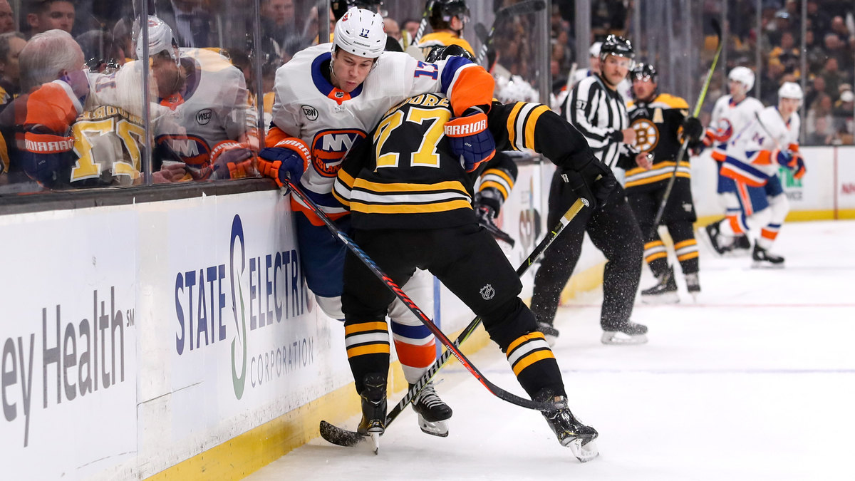 Boston Bruins defenseman John Moore, New York Islanders forward Matt Martin