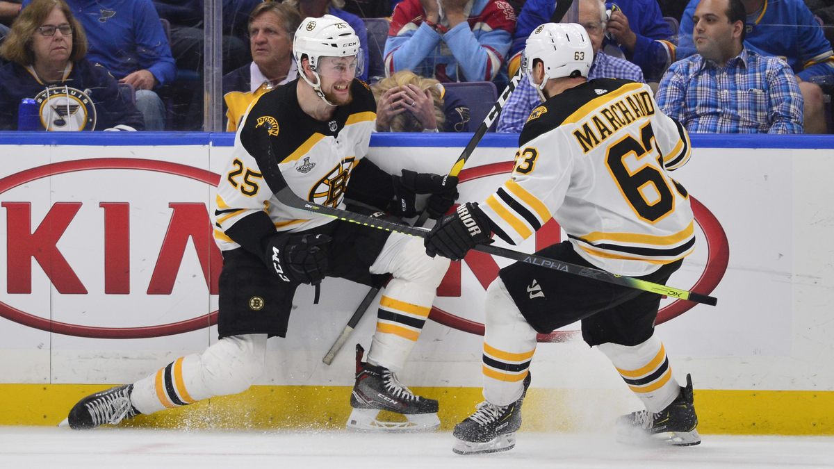 Boston Bruins defenseman Brandon Carlo, winger Brad Marchand