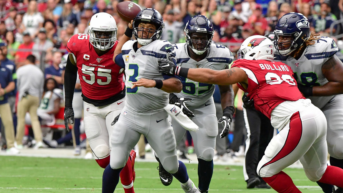 Arizona Cardinals linebacker Chandler Jones and Seattle Seahawks quarterback Russell Wilson