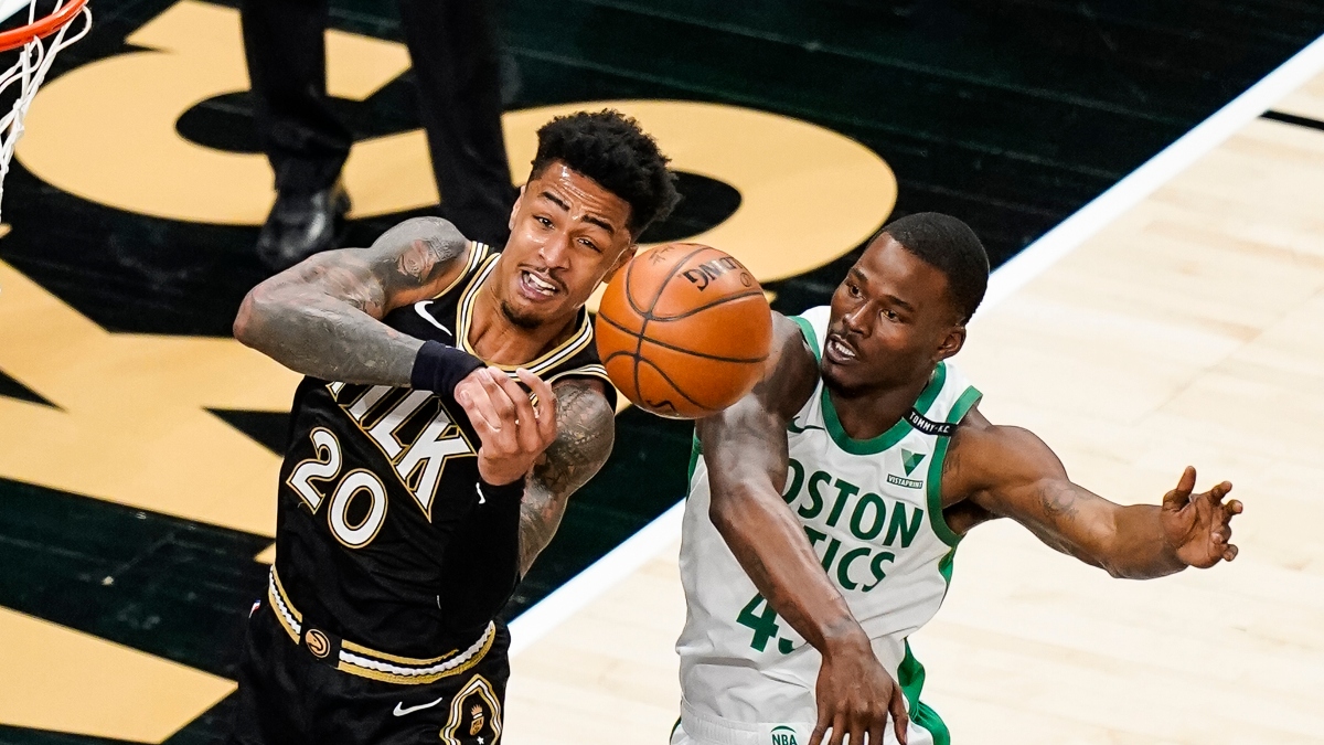 Atlanta Hawks forward John Collins (20) and Boston Celtics guard Javonte Green (43)