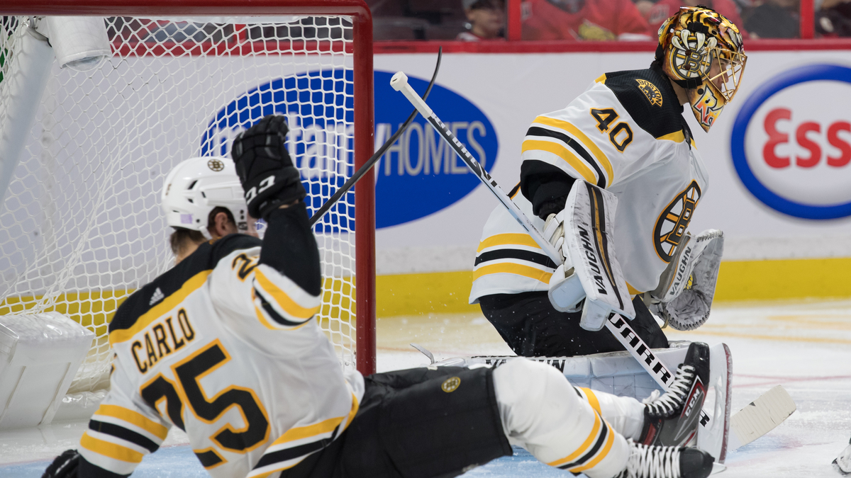 Boston Bruins defenseman Brandon Carlo, goalie Tuukka Rask