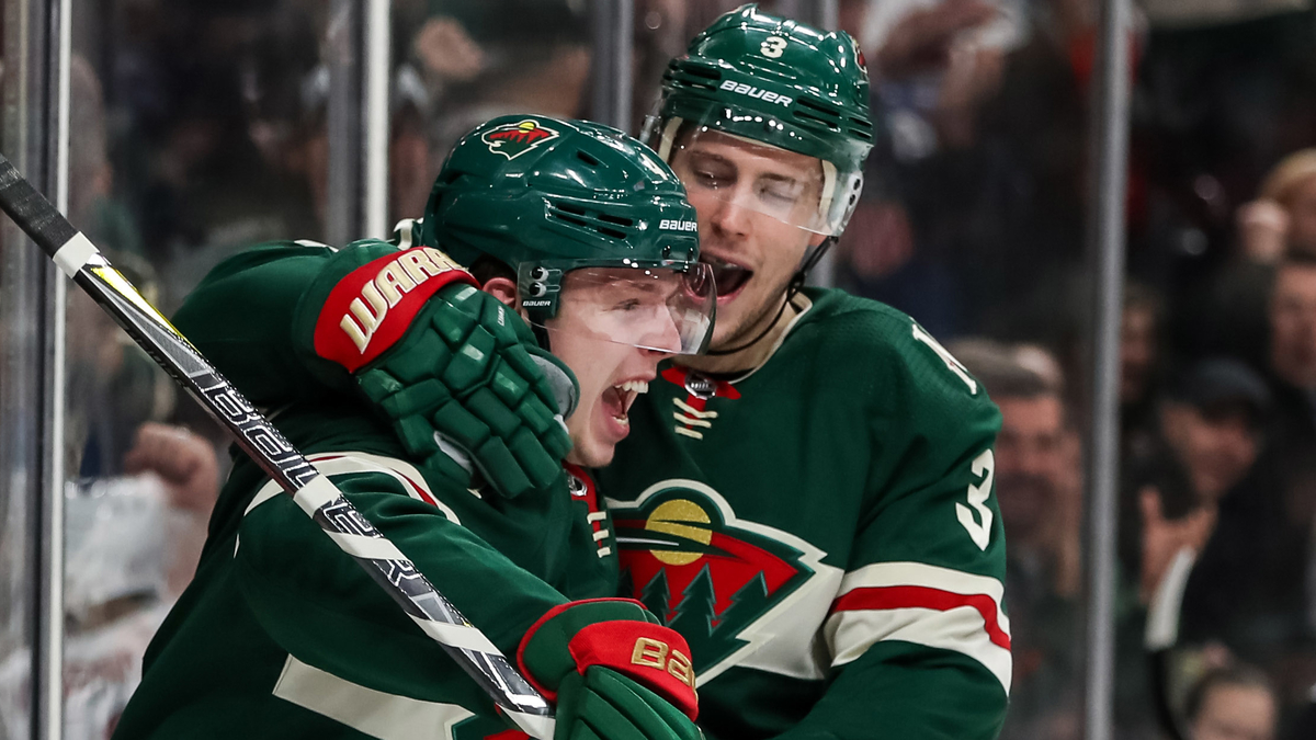 Boston Bruins defenseman Mike Reilly, center Charlie Coyle