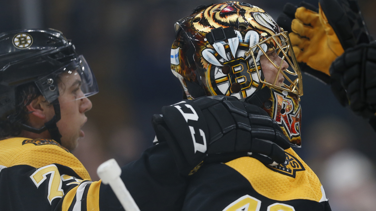 Boston Bruins defenseman Charlie McAvoy, goalie Tuukka Rask