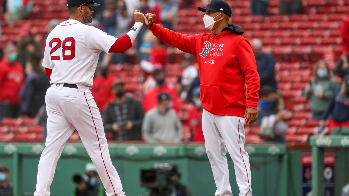 Boston Red Sox manager Alex Cora (right) and left fielder J.D. Martinez
