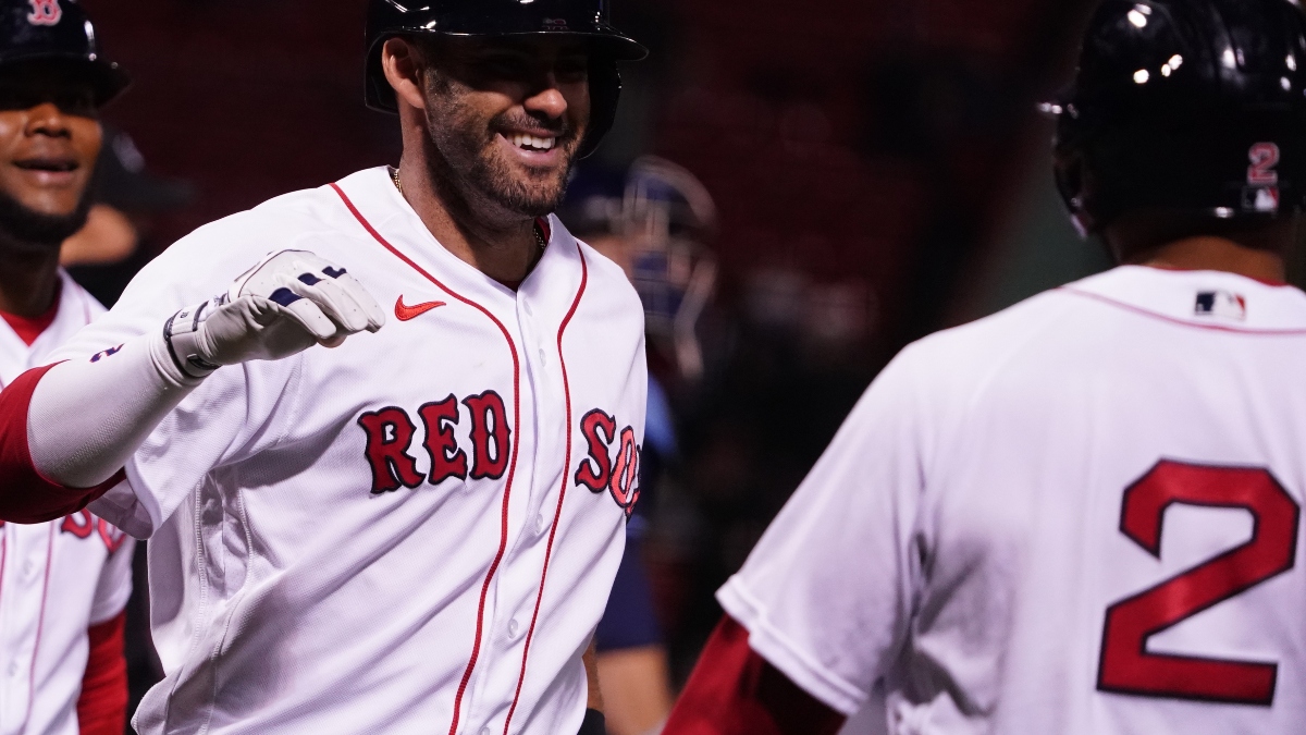 Boston Red Sox designated hitter J.D. Martinez (center), shortstop Xander Bogaerts (right) and outfielder Franchy Cordero (left)