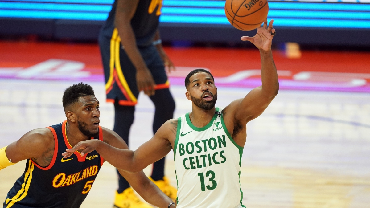 Boston Celtics center Tristan Thompson (13) and Golden State Warriors forward Kevon Looney (5)