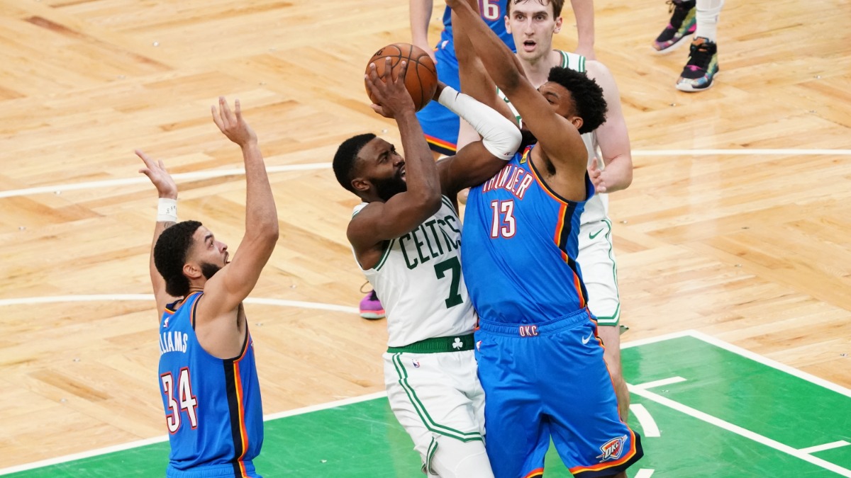 Oklahoma City Thunder center Tony Bradley and Boston Celtics guard Jaylen Brown