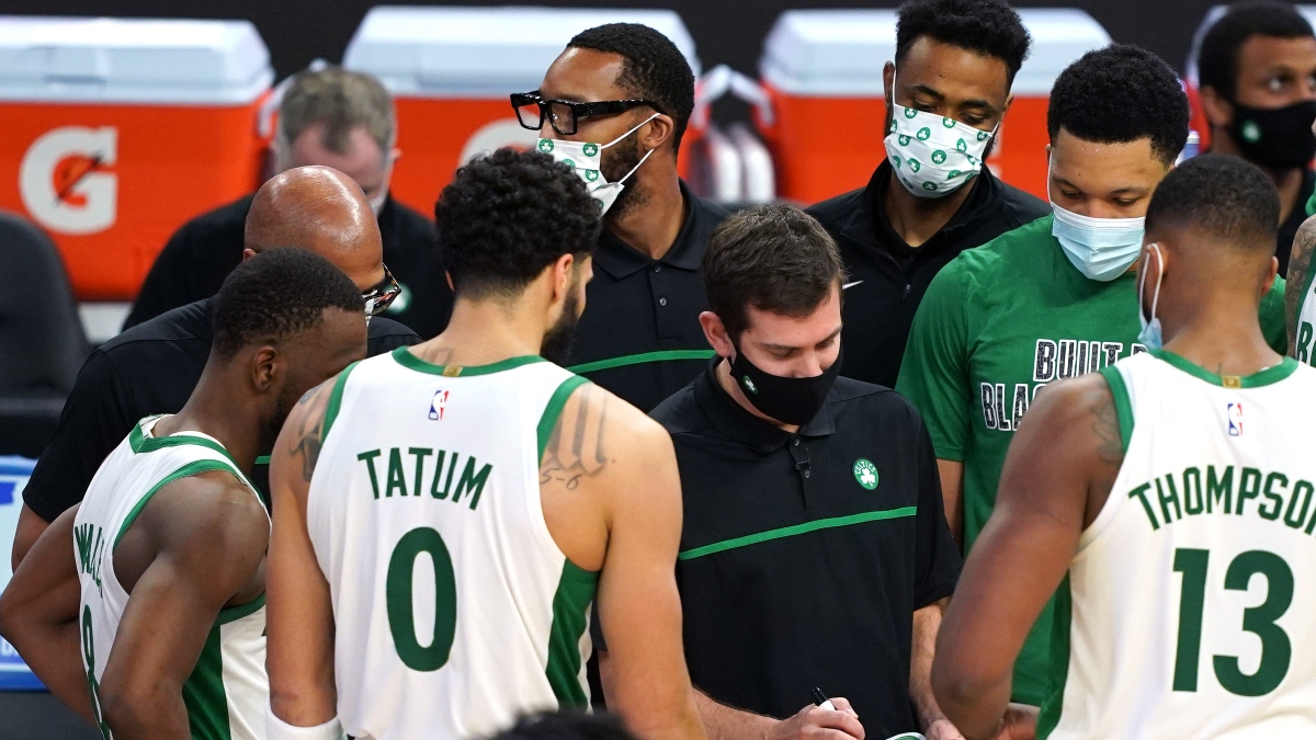 Boston Celtics head coach Brad Stevens, point guard Kemba Walker (left), forward Jayson Tatum (0) and center Tristan Thompson (13)