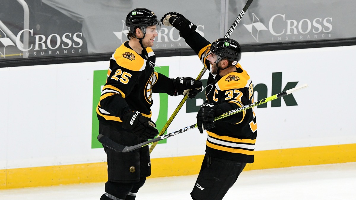 Boston Bruins Defenseman Brandon Carlo, Center Patrice Bergeron