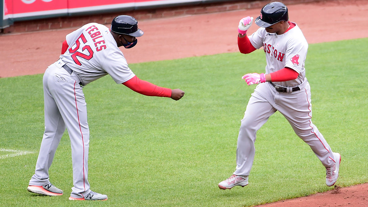 Boston Red Sox third base coach Carlos Febles and third baseman Rafael Devers