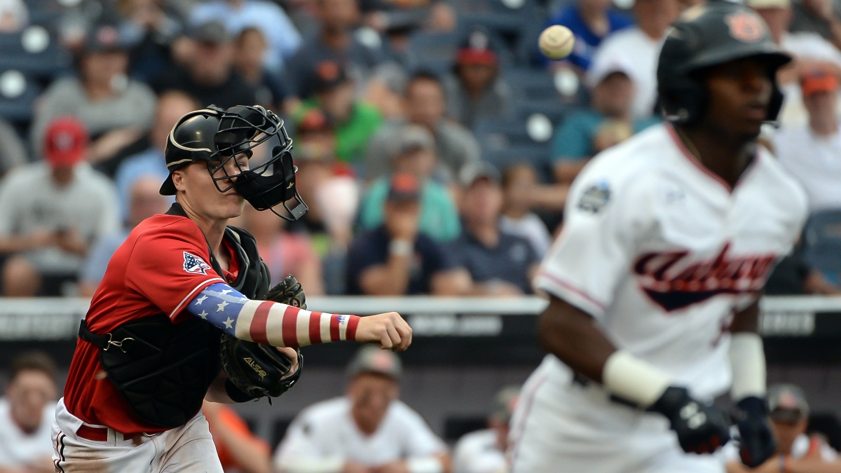 Louisville Cardinals catcher Henry Davis (32) and Auburn Tigers second baseman Ryan Bliss (9)